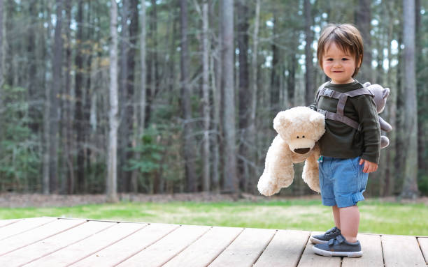 istock Happy toddler boy playing outside 1136476946