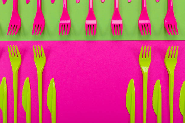 istock Colorful set of plastic table ware isolated on background 1136477050