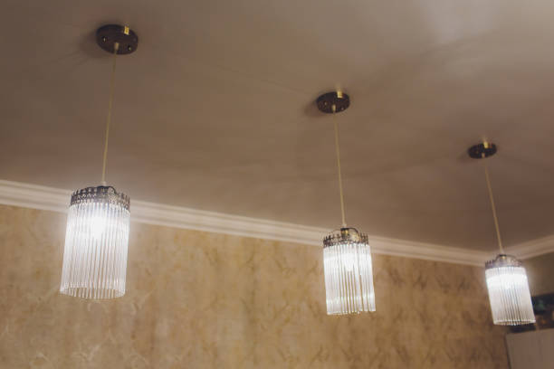 istock Beautiful chandelier. Modern chandelier hanging under ceiling. 1136477728