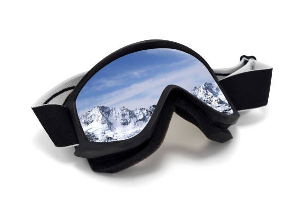 istock Ski goggles with reflection of winter snowy mountains 1136478112