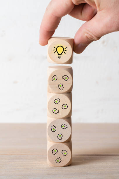 istock many people together having an idea symbolized by icons on cubes 1136478821
