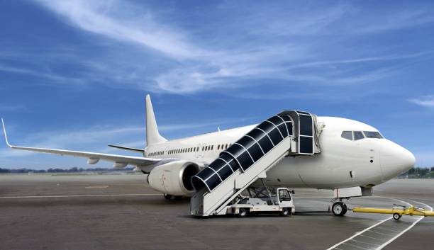istock Airplane at airport terminal preparing for passenger boarding 1136491949
