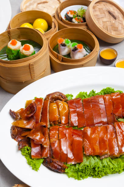 istock Delicious Golden Roasted BBQ Suckling pig on table. 1136492833