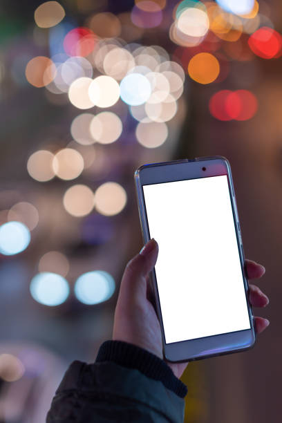 istock Woman holding a smartphone with blank screen 1136495633