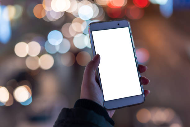 istock Woman holding a smartphone with blank screen 1136495712