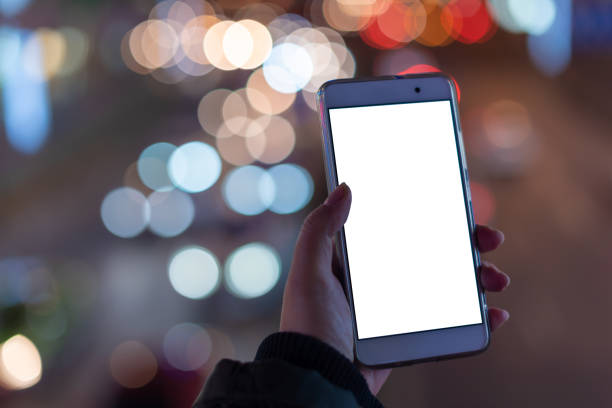 istock Woman holding a smartphone with blank screen 1136495721
