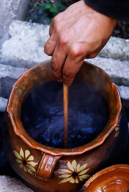 istock chef moving beans in ceramic pot, with wooden shovel 1136500393
