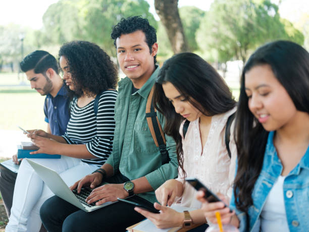 istock Latin college student with friends 1136501721