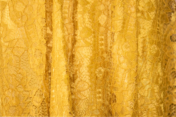 istock Lace fabric background, yellow lace fabric 1136504613