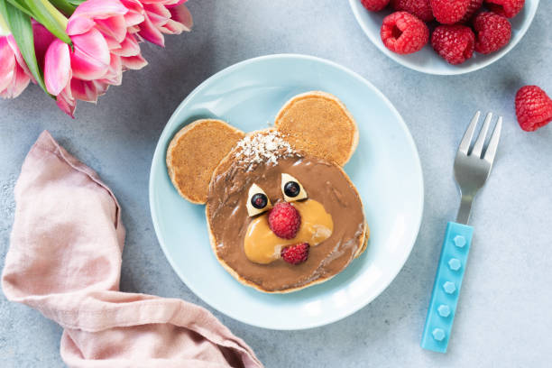 istock Cute bear shape pancake with nut butter for kids 1136505816