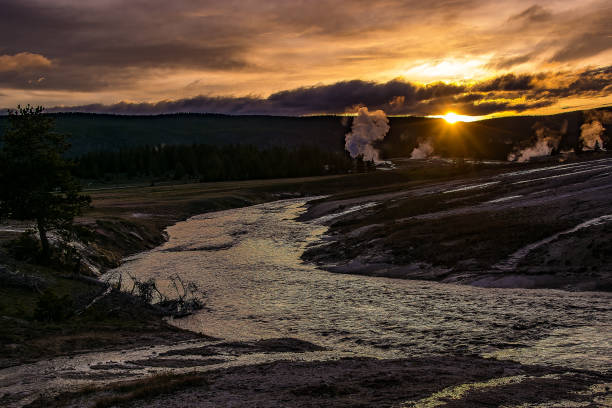 istock Sunset over firehole thermal steam fields of Yellowstone 1136509528