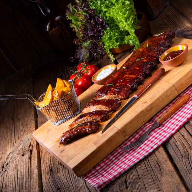 istock delicious grilled ribs with barbecue barbecue sauce 1136514590