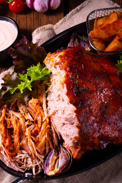 istock delicious pulled pork with baked potato quarters 1136514630
