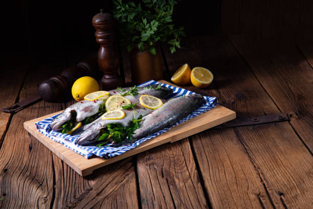 istock fresh trout with lemon and different herbs 1136515256