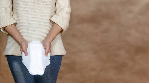 istock Young woman holding a menstrual pad 1136515553