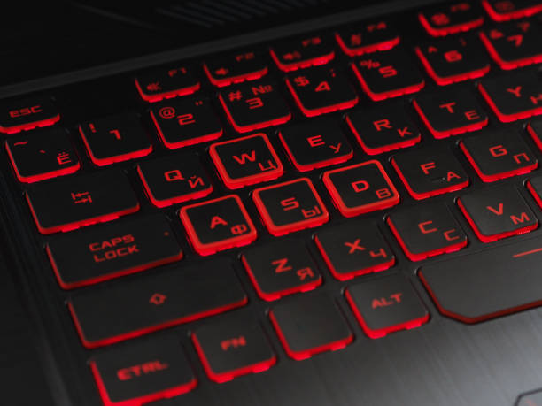 istock Black and red gaming laptop keyboard 1136515600