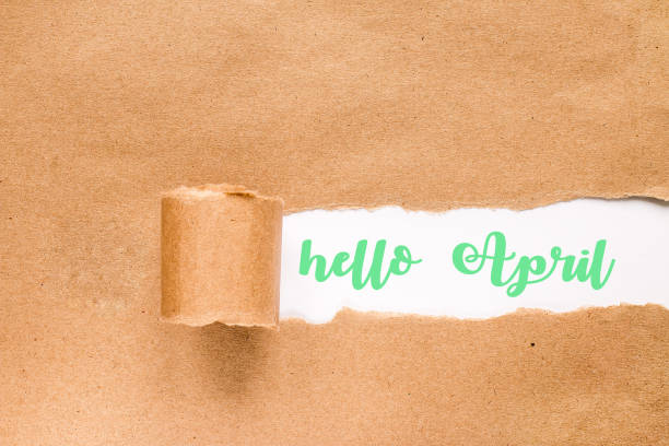 istock Hello april  concept. Inscription in torn envelope. 1136517216