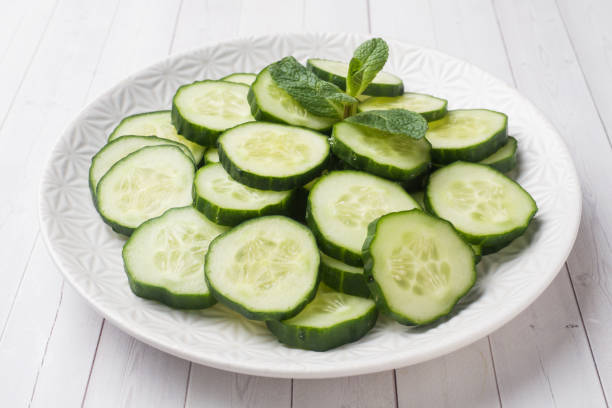istock Sliced cucumber with mint on a plate. concept diet. 1136519747