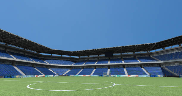 istock Empty seats football stadium with blue sky background,3D rendering 1136520888