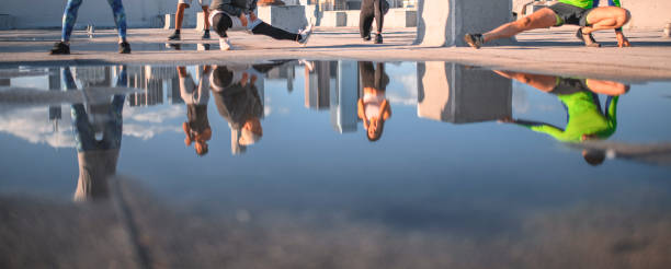 istock Friends exercising together at building terrace 1136521101