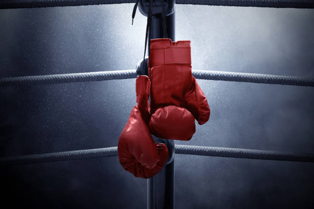 Boxing gloves hanging Boxing gloves hanging boxing sport stock pictures, royalty-free photos & images