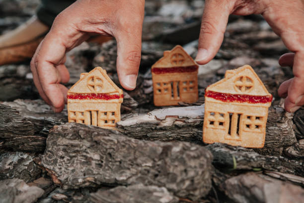 istock Biscuitshaped cookie stands on bark of  tree 1136524545