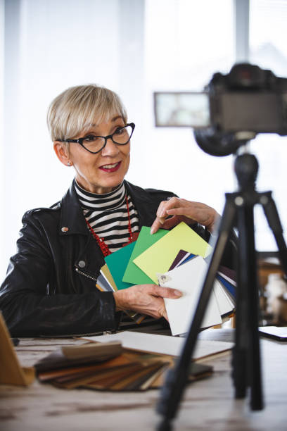 istock Vlogger showing color swatch to the camera 1136525856