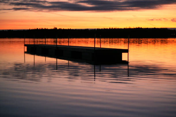 istock Small jetty floating in the water 1136527043