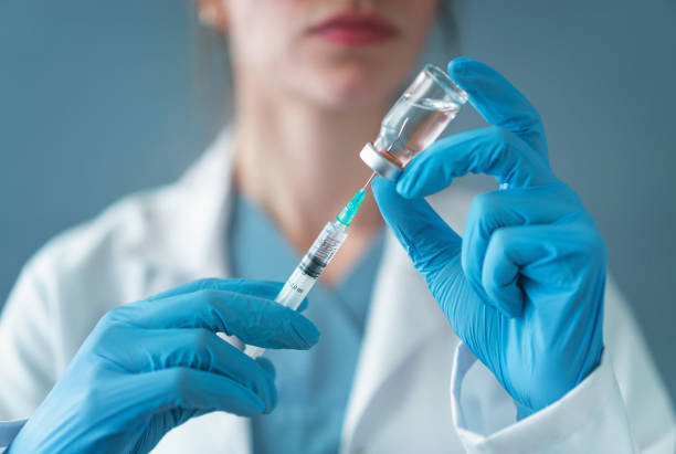 istock The doctor prepares the syringe for vaccination 1136527910