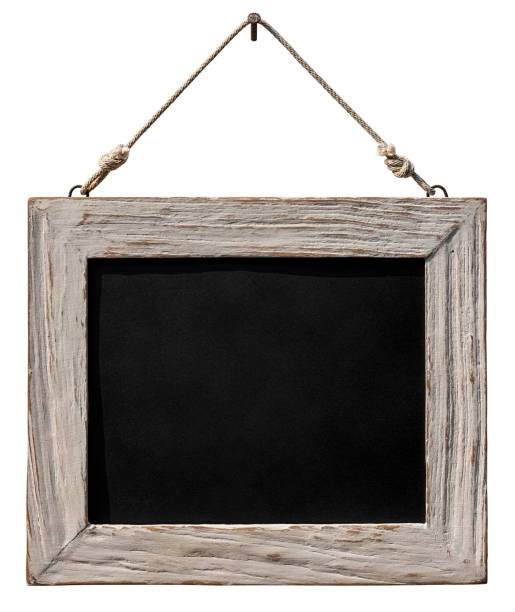 istock An old white weathered teak wooden framed blackboard hangs from an old rusty nail by old rope against a white background. Isolated on white, clipping path included. 1136531167