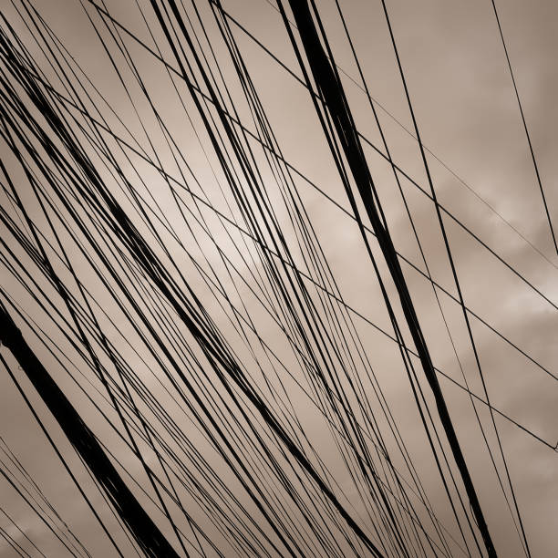 istock power lines and cloudy sky, background, toning 1136531381