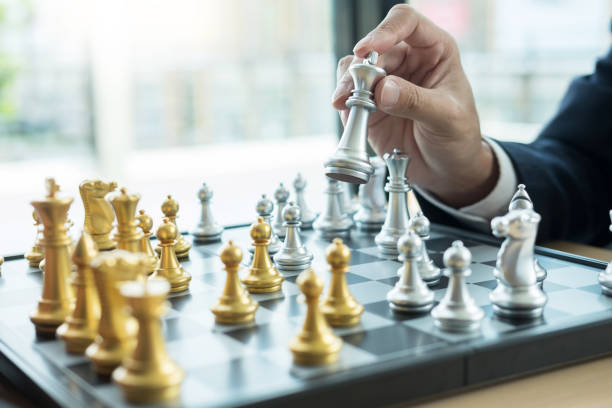 istock Close-Up Of Businessman Playing Chess 1136532407