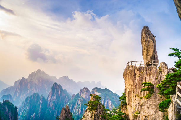 Landscape of Yellow Mountains Flying-over Rock (Falling Rock from Sky). Landscape of Huangshan (Yellow Mountains), located in eastern China. It is a UNESCO World Heritage Site, and one of China's major tourist destinations. huangshan mountains stock pictures, royalty-free photos & images