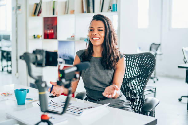 istock Businesswoman vlogging at the office 1136538370