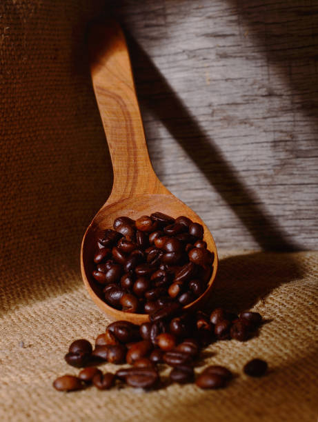 istock Coffee beans in a wooden scoop. 1136539498