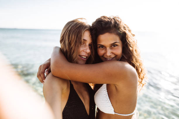 istock friends take a selfie at the beach 1136540237