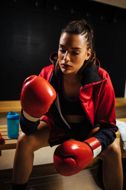 istock Young woman preparing for the muay thai workout 1136542638