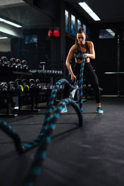 istock Battle ropes session at the gym 1136542656