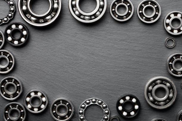 frame of various ball bearings with free space. technology and machinery industrial background. - ball bearing engineer machine part gear imagens e fotografias de stock