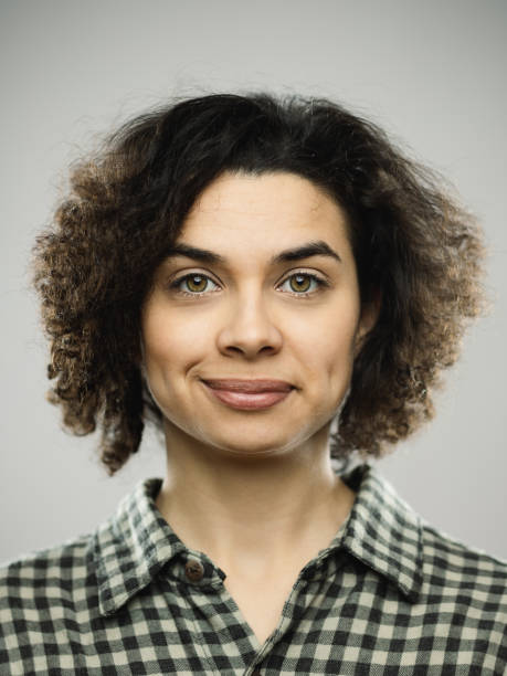 Studio portrait of young woman with happy expression