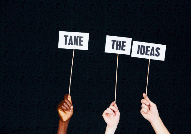 istock Three mixed hands hold signs saying 