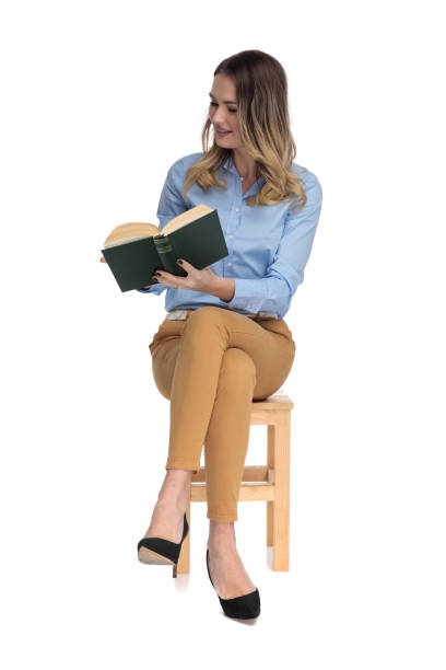 istock relaxed fascinated businesswoman reads while sitting 1136547882