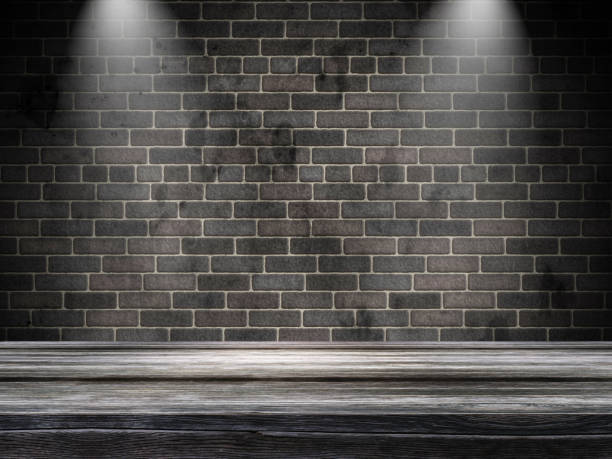 istock 3D old wooden table against a brick wall with spotlights 1136550024