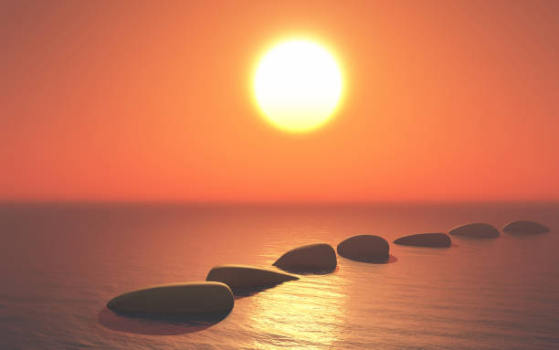 istock 3D stepping stones in ocean against a sunset sky 1136550032