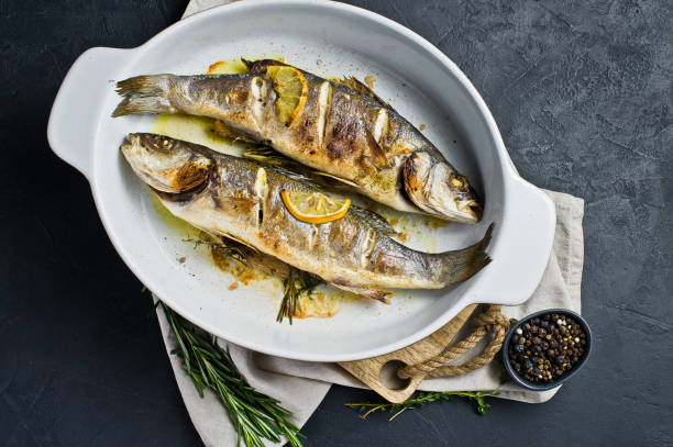 istock Grilled sea bass. Black background, top view. 1136550127