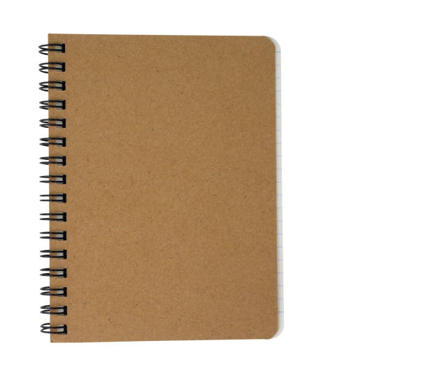 istock Top view of brown spiral notebook on white background. (clipping path) 1136550766