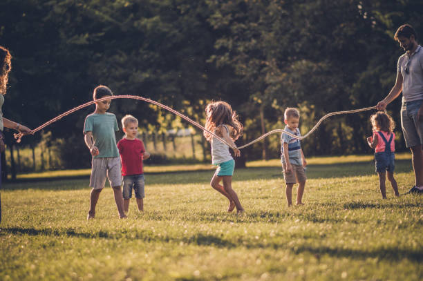istock Group of children playing in public park 1136552121