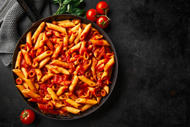 istock Classic penne pasta with tomato sauce 1136552130