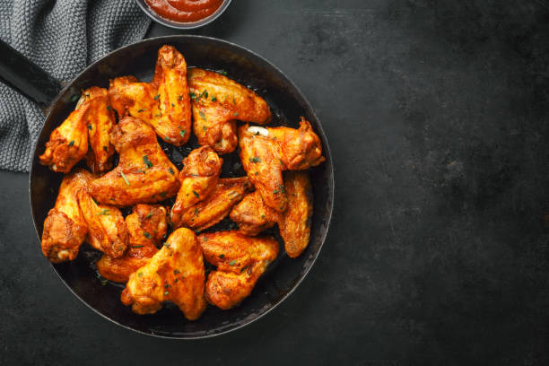 istock Chicken wings grilled in sauce on pan 1136552272