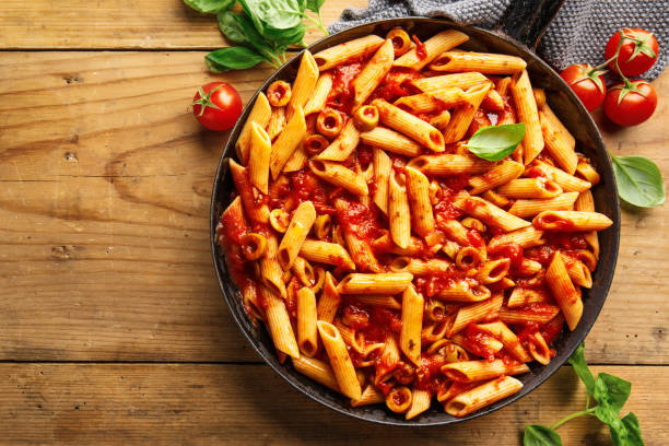istock Classic penne pasta with tomato sauce 1136553988